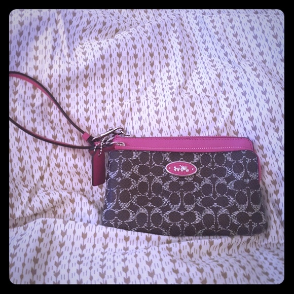 Coach Handbags - Coach Wristlet two pockets. Pink/Brown Gently used